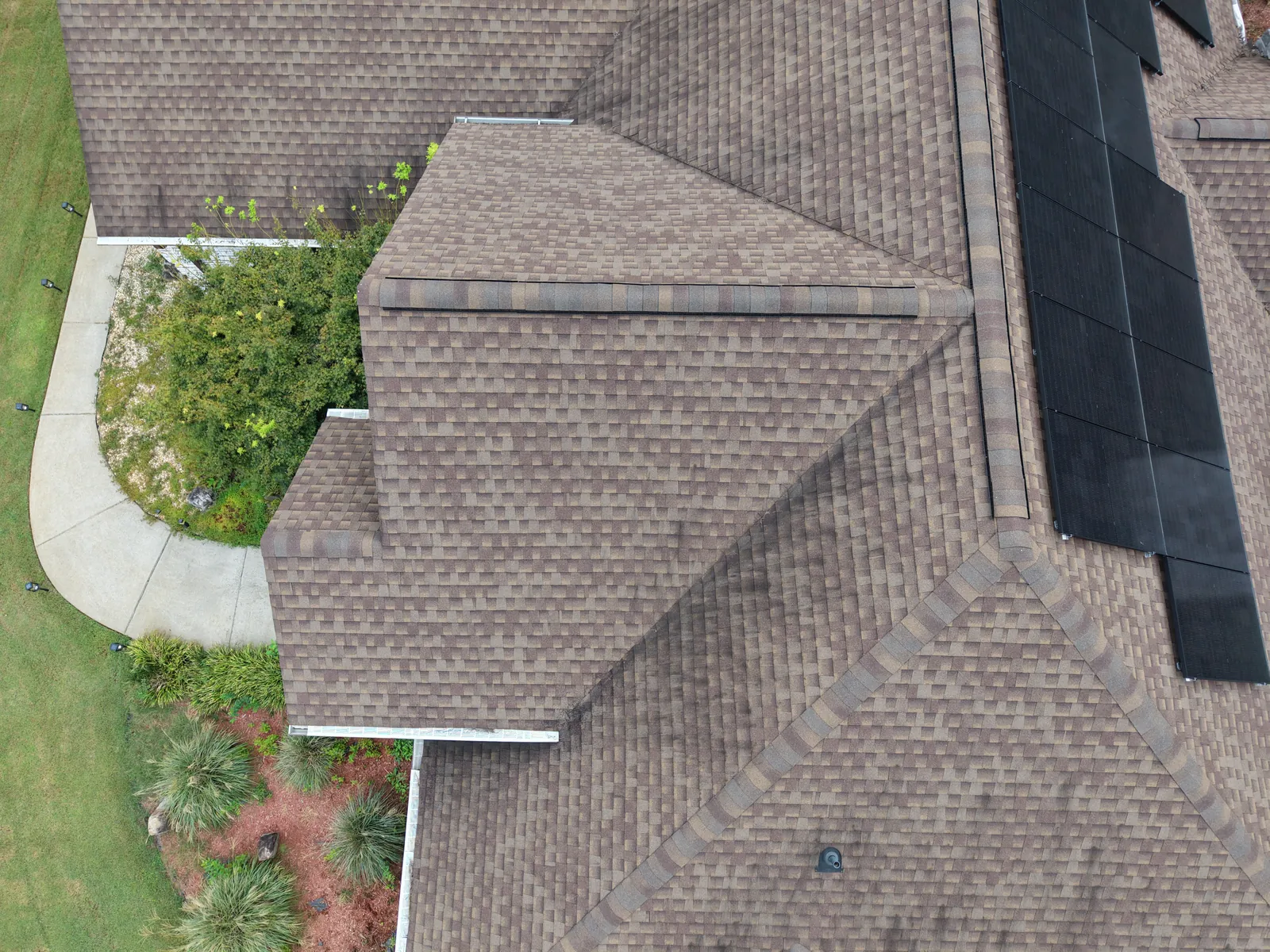 Aerial view of intersecting roof planes and ridgelines