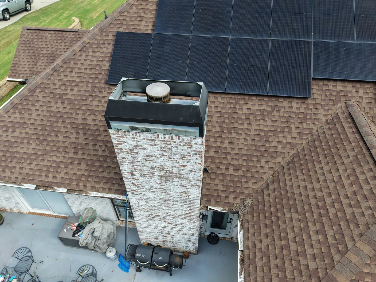 Aerial view of rooftop equipment and surrounding shingle roof