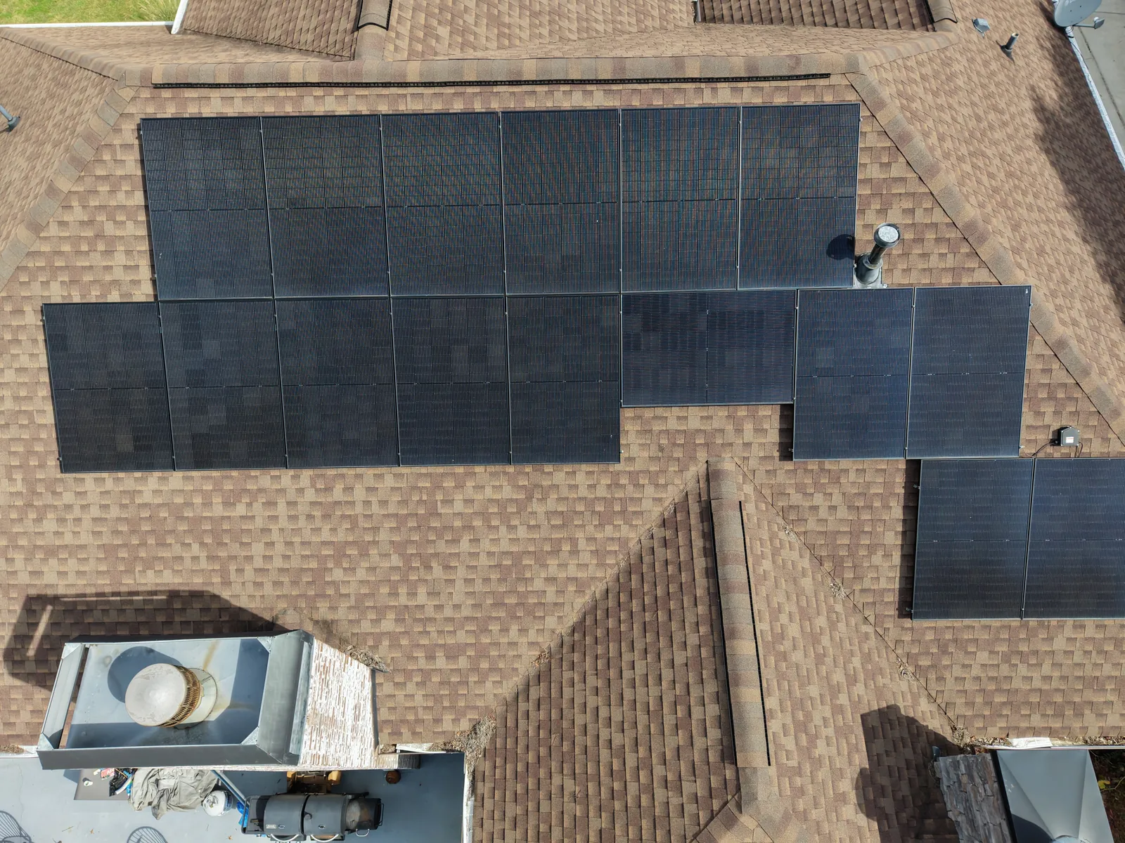 Aerial view of a rooftop solar panel array